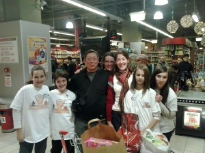 Canadian guy at the food drive with helpers